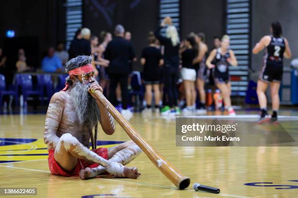 Gadigal man David Weatherall plays the didgeridoo before the round 15 WNBL match between Sydney Flames and Bendigo Spirit at Brydens Stadium, on...