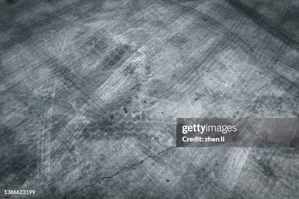 empty cement floor background - reifenspur stock-fotos und bilder