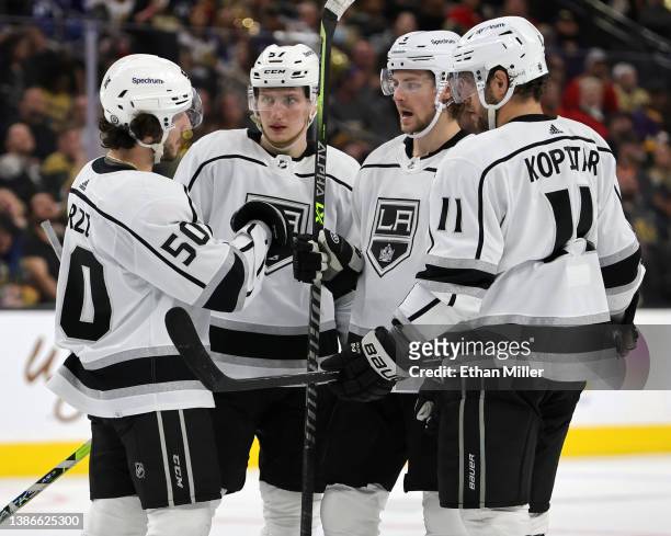 Sean Durzi, Jacob Moverare, Adrian Kempe and Anze Kopitar of the Los Angeles Kings talk during a break in the third period of their game against the...