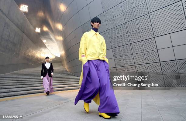 In this image released on March 20, models showcase designs by CARUSO in a prerecorded runway show as a part of Seoul Fashion Week 2022 AW on March...