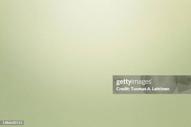 beige textured paper background with light effect. copy space. - beige stock-fotos und bilder