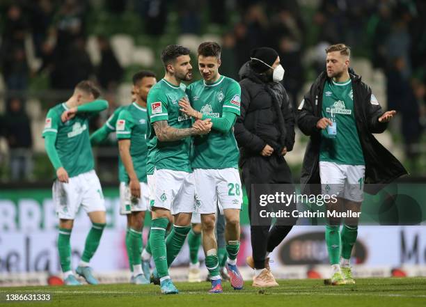 Anthony Jung and Ilia Gruev of Werder Bremen celebrate their side's victory after the Second Bundesliga match between SV Werder Bremen and SV...