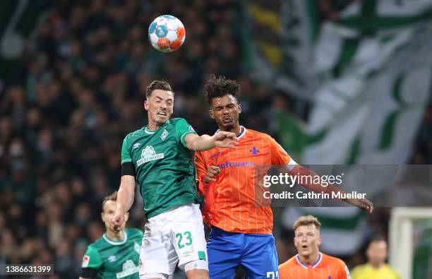 Nicolai Rapp of Werder Bremen and Aaron Seydel of SV Darmstadt 98 battle for the ball during the Second Bundesliga match between SV Werder Bremen and...