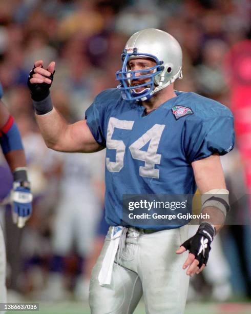 Linebacker Chris Spielman of the Detroit Lions signals to the sideline during a game against the Minnesota Vikings at the Pontiac Silverdome on...