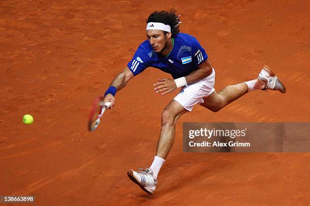 Juan Monaco of Argentina returns the ball to Philipp Petzschner of Germany on day 1 of the Davis Cup World Group first round match between Germany...