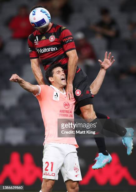 Tomer Hemed of the Wanderers heads the ball over Javier Lopez Rodríguez of United during the A-League Mens match between Western Sydney Wanderers and...
