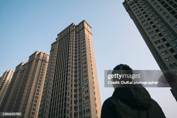 low angle view of residential buildings in beijing - population explosion stock pictures, royalty-free photos & images