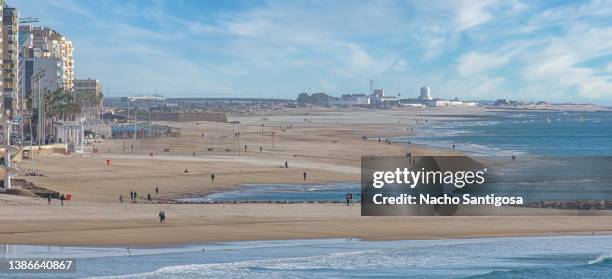 an infinite city beach - andalucia beach stock pictures, royalty-free photos & images