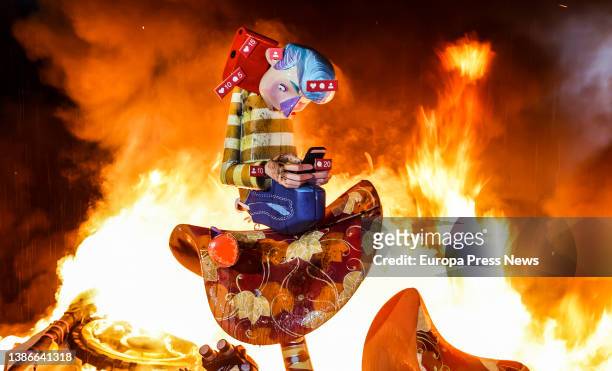 Falla, of a boy with a cell phone, is burned during the Crema, on 20 March, 2022 in Valencia, Valencian Community, Spain. The crema is the act of...
