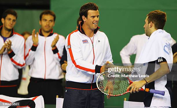 Leon Smith, Coach of Great Britain congratulates Daniel Evans of Great Britain during his match against Lukas Lacko of the Slovak Republic during day...