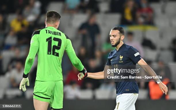 Amine Gouiri of France and Ukraine goalkeeper Anatoliy Trubin shake hands after a collision during the UEFA Under-21 EURO 2023 Finals Quarter-Final...