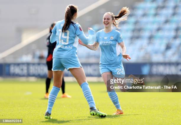 Caroline Weir of Manchester City celebrates with teammate Keira Walsh after scoring their side's third goal during the Vitality Women's FA Cup...