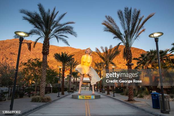 Popular outdoor sculpture/statue entitled "Forever Marilyn" by artist Seward Johnson, located directly across from the Palm Springs Art Museum, is...