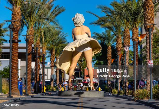 Popular outdoor sculpture/statue entitled "Forever Marilyn" by artist Seward Johnson, located directly across from the Palm Springs Art Museum, is...