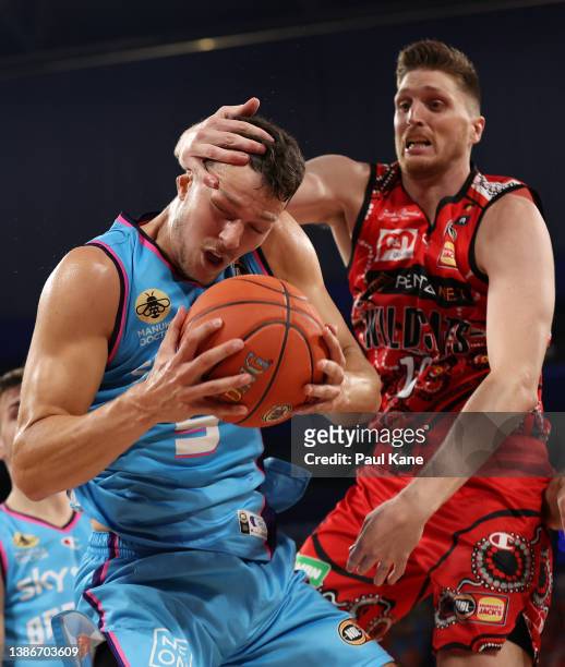 Matthew Hodgson of the Wildcats fouls Yanni Wetzell of the Breakers during the round 16 NBL match between Perth Wildcats and New Zealand Breakers at...