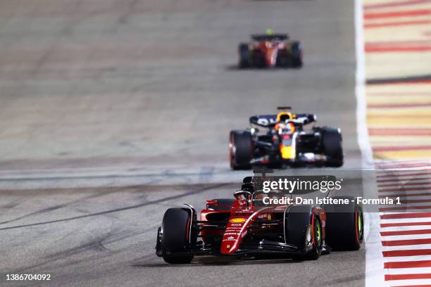 Charles Leclerc of Monaco driving the Ferrari F1-75 leads Max Verstappen of the Netherlands driving the Oracle Red Bull Racing RB18 during the F1...