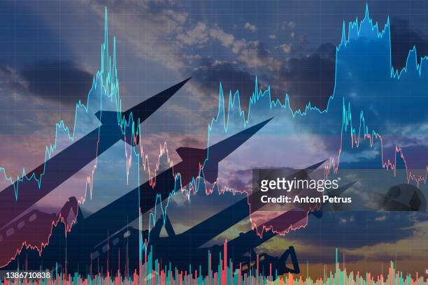 missiles on the background of stock charts. economic crisis due to war - ukraine war photos et images de collection