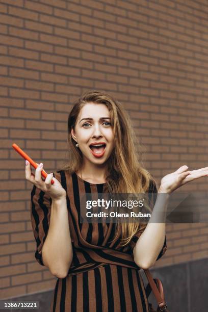 shouting young woman gesturing with smart phone. - woman collapsing stock pictures, royalty-free photos & images