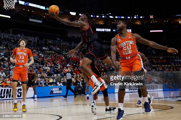 Taze Moore of the Houston Cougars shoots the ball as Da'Monte Williams of the Illinois Fighting Illini defends in the first half of the game during...