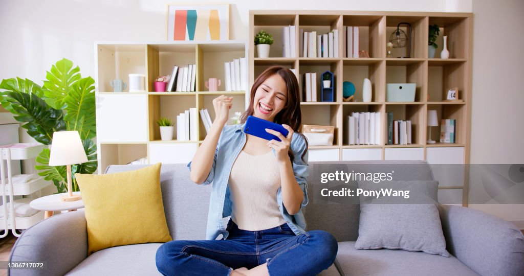 Woman play mobile game