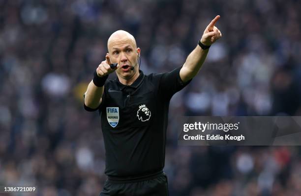 Referee Anthony Taylor gestures during the Premier League match between Tottenham Hotspur and West Ham United at Tottenham Hotspur Stadium on March...