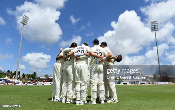 England huddle ahead of the 4th innings during day five of the 2nd test match between West Indies and England at Kensington Oval on March 20, 2022 in...