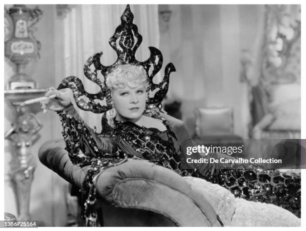 Actress Mae West models an exquisite outfit as 'The Frisco Doll/Rose Carlton/Sister Annie Alden' in a scene from the movie 'Klondike Annie' United...