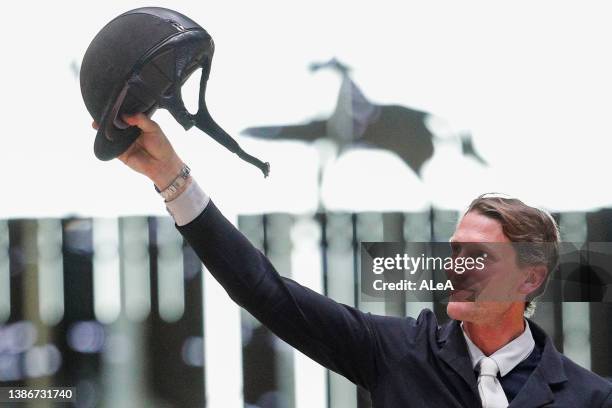 French rider Kevin Staut celebrates after winning the Grand Prix Hermès 1.60m - Table A with Jump-Off CSI 5* at the Grand Palais Ephemere on March...