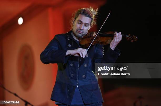 David Garrett performs at the musical peace rally Sound of Peace at the Brandenburg Gate on March 20, 2022 in Berlin, Germany. The televised event...