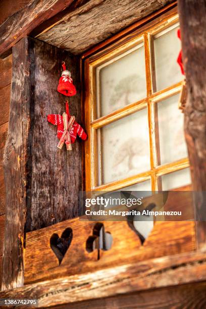 wooden window frame with cute decoration of hearts and tiny skis - alpine chalet stock pictures, royalty-free photos & images