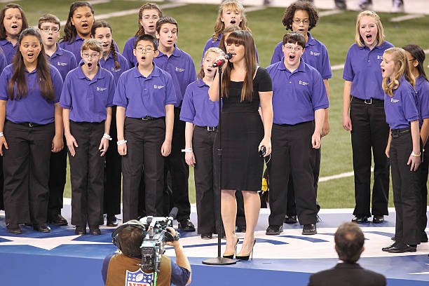 Kelly Clarkson performs the National Anthem during the Bridgestone Super Bowl XLVI Pregame Show at Lucas Oil Stadium on February 5, 2012 in...