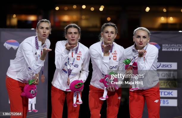 Natalia Kaczmarek, Iga Baumgart-Witan, Kinga Gacka and Justyyna Swiety-Ersetic of Poland POL pose during the Women's 4x400 Metres Relay Final Medal...