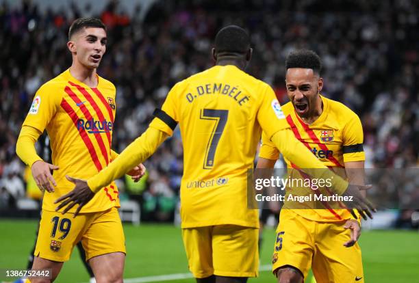 Pierre-Emerick Aubameyang of FC Barcelona celebrates with his teammate Ousmane Dembele Ousmane Dembele after scoring the opening goal during the...