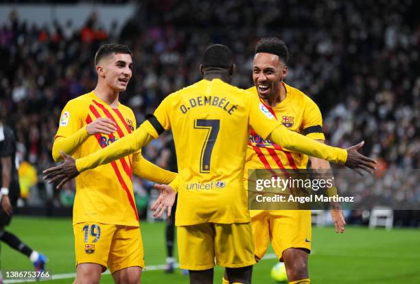 Pierre-Emerick Aubameyang of FC Barcelona celebrates with his teammate Ousmane Dembele and Ferran Torres after scoring the opening goal during the...