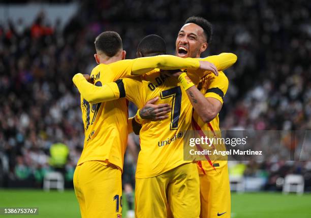 Pierre-Emerick Aubameyang of FC Barcelona celebrates with his teammate Ousmane Dembele and Ferran Torres after scoring the opening goal during the...