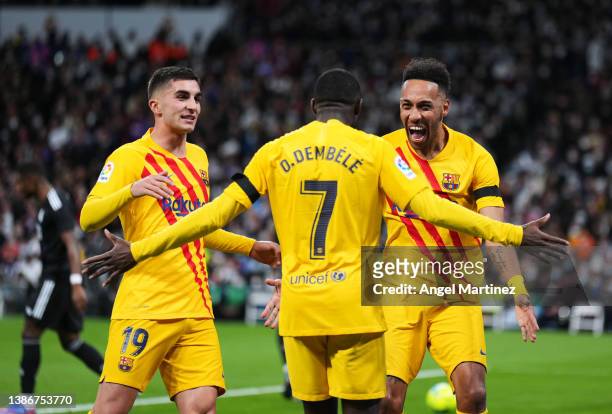 Pierre-Emerick Aubameyang of FC Barcelona celebrates with his teammate Ousmane Dembele and Ferran Torres after scoring the opening goal during the...