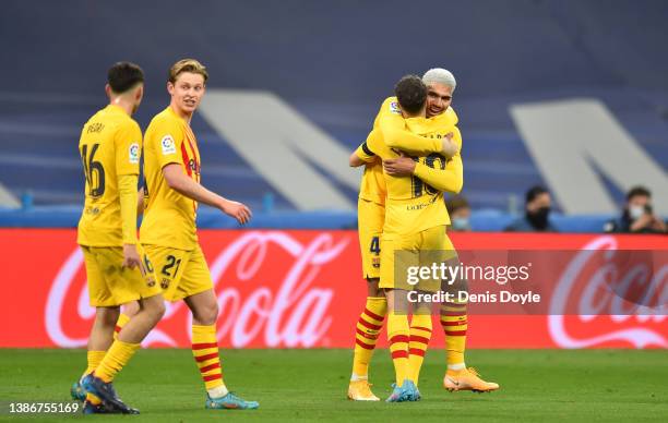 Ronald Araújo of Barcelona celebrates with Jordi Alba after scoring their team's second goal during the LaLiga Santander match between Real Madrid CF...