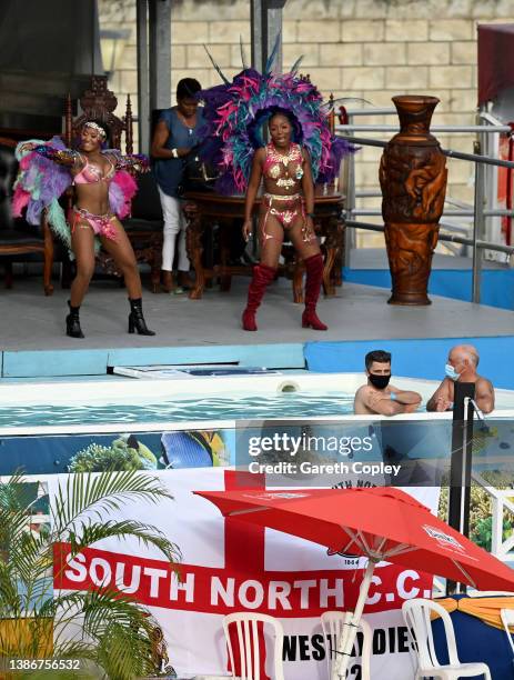 Cricket fans watch from the swimming pool in the party stand during day five of the 2nd test match between West Indies and England at Kensington Oval...