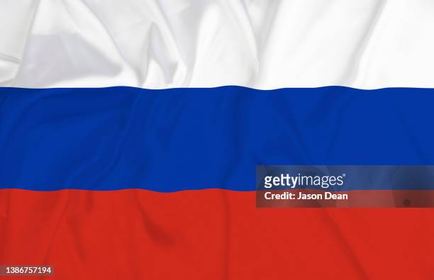 waving russian flag - russian flag foto e immagini stock