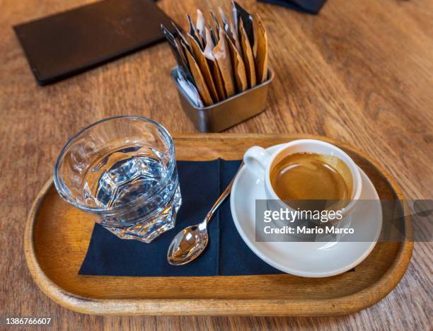 coffee and water - black cup saucer stock pictures, royalty-free photos & images