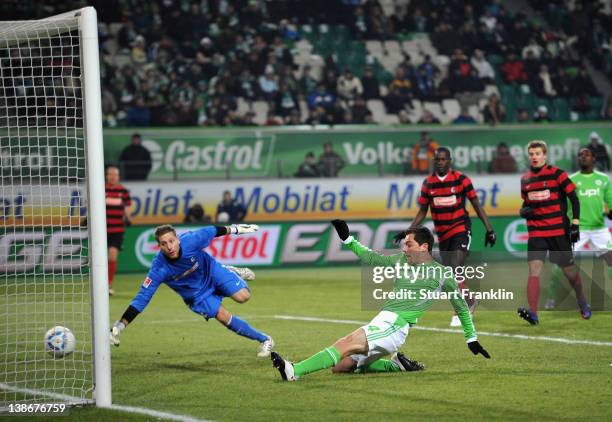 Marcel Schaefer of Wolfsburg scores the second goal during the Bundesliga match between VfL Wolfsburg and SC Freiburg at Volkswagen Arena on February...