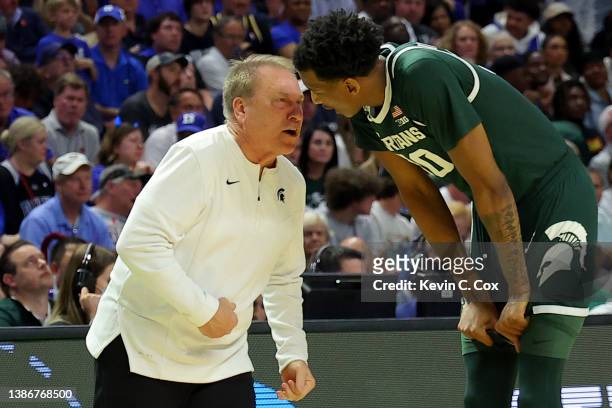Head coach Tom Izzo of the Michigan State Spartans talks with Marcus Bingham Jr. #30 of the Michigan State Spartans in the second half against the...