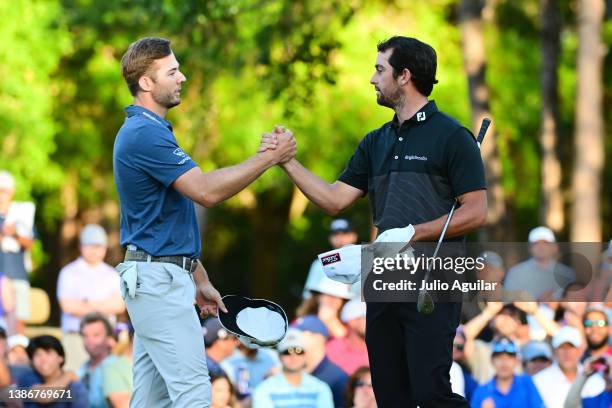 Davis Riley of the UNited States and Sam Burns of the United States embrace on the 16th green after Burns defeated Riley during a playoff in the...