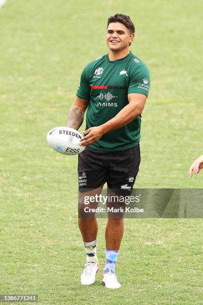 Latrell Mitchell shares a laugh with a team mate during a South Sydney Rabbitohs NRL training session at Redfern Oval on March 21, 2022 in Sydney,...