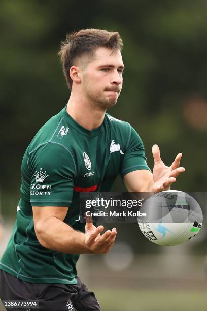 Lachlan Ilias passes during a South Sydney Rabbitohs NRL training session at Redfern Oval on March 21, 2022 in Sydney, Australia.