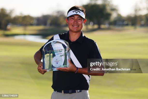 Carl Yuan of China poses with the trophy on the eighteenth green after winning the Chitimacha Louisiana Open presented by MISTRAS at Le Triomphe G&CC...