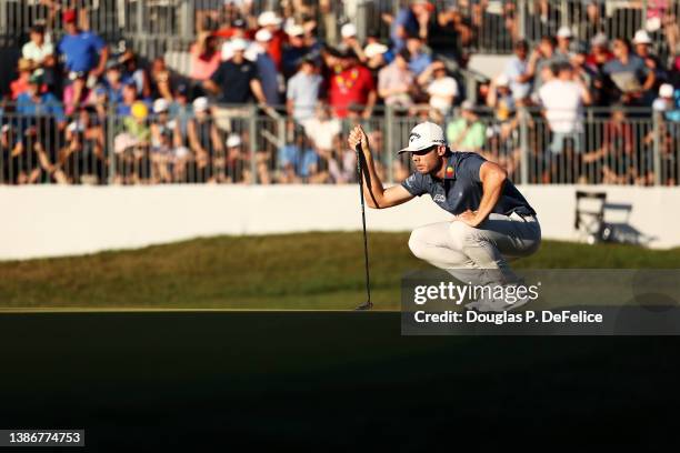 Sam Burns of the United States lines up a putt on the 18th green during a playoff in the final round of the Valspar Championship on the Copperhead...