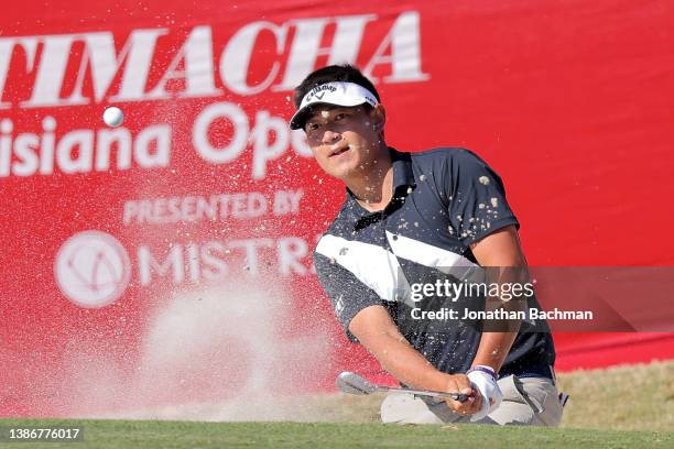 Carl Yuan of China plays a shot out of the bunker onto the eighteenth green during the final round of the Chitimacha Louisiana Open presented by...