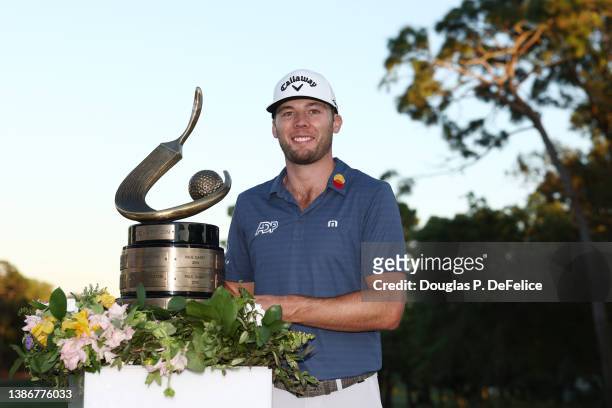 Sam Burns of the United States celebrates with the trophy after winning during a playoff in the final round of the Valspar Championship on the...