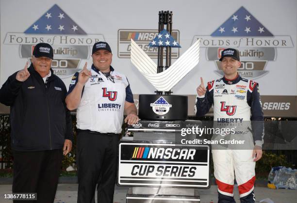 Hendrick Motorsports owner Rick Hendrick, crew chief Rudy Fugle and William Byron, driver of the Liberty University Chevrolet, celebrate in victory...